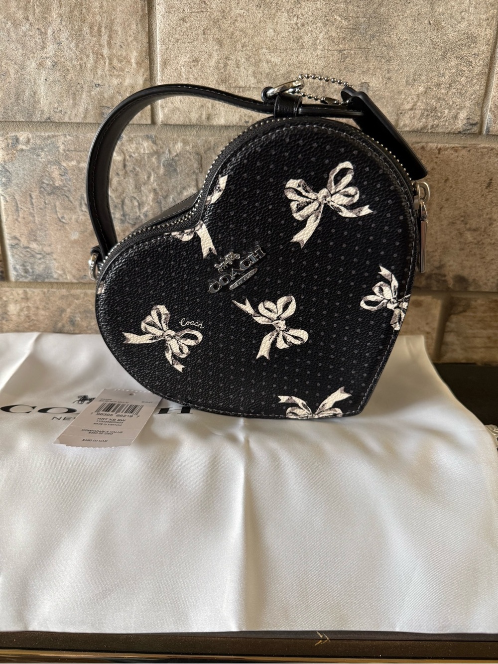Coach Black Heart-Shaped Mini Crossbody with White Bow Print